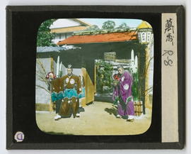 Two figures in ceremonial dress