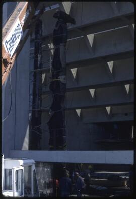 A totem pole being positioned in the Museum of Anthropology