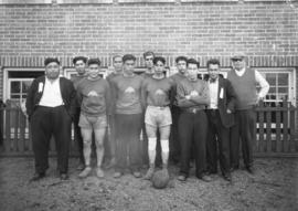 Men's sports team posing