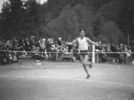 Runner crossing finish line