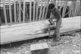 Crew working on log at the Turnbull & Gail construction yard in Richmond (contractors for bui...