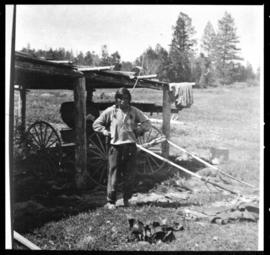 Portrait of a man and wagon