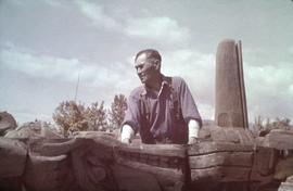 Mungo Martin working on a totem pole