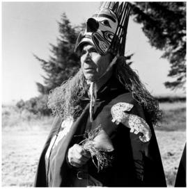 Mr. Wilson dressed in the traditional robes and mask of the [Nuu-chah-nulth]