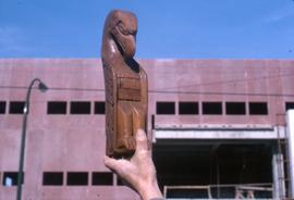 Eagle carving held aloft