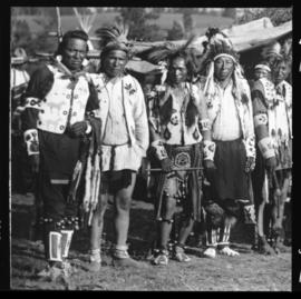 Group portrait of men in native clothing, view three