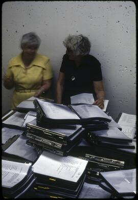 Museum staff preparing museum catalogues