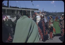 Group in ceremonial dress on dock, Alert Bay