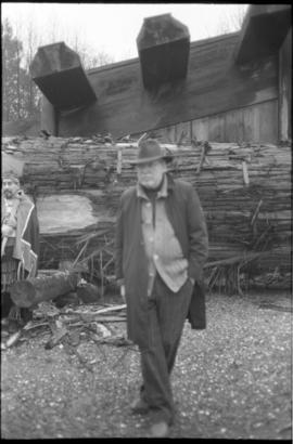 Bill Reid in front of canoe log