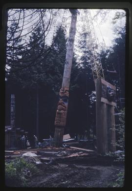 Memorial pole being raised in the Haida Village