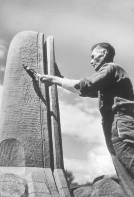 Mungo Martin adzing a totem pole
