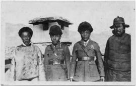 Group of four men posed for photograph