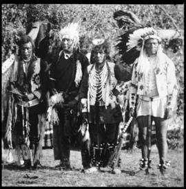 Portrait of four men in native dress