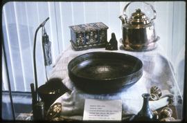 A teapot, bowl, and other items on display at the Vancouver Centennial Museum
