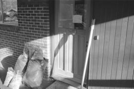 [Carving and wood scraps next to door]