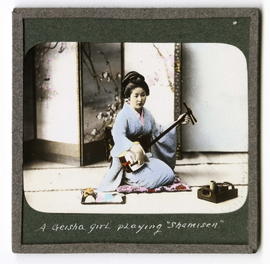 A Geisha girl playing shamisen