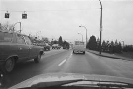 [Truck with log travelling on highway]