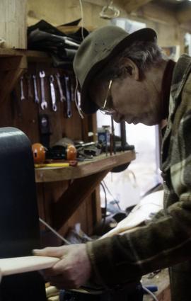 [Bill Reid working in the shop]