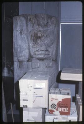 Packed items and a house post in the old Museum of Anthropology