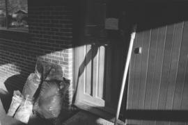 [Carving and wood scraps next to door]