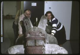 Inge Ruus and Anthony Carter posing with wasgo sculpture in the new Museum of Anthropology