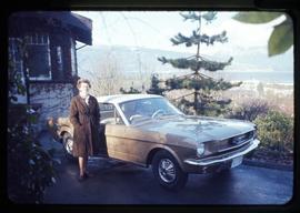 Audrey Hawthorn standing by a Mustang