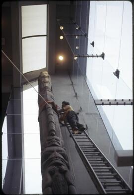 Totem pole being secured in the Great Hall