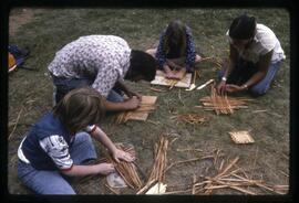 Children weaving cedar