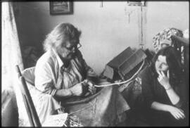 Mrs. Matilla Jim weaving while Andrea LaForet looks on. (Mt. Currie)