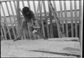 Crew working on log at the Turnbull & Gail construction yard in Richmond (contractors for bui...