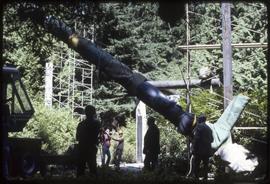 A totem pole in the process of being moved