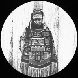 Man dressed in blanket and headdress