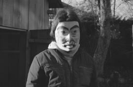 [Unidentified person wearing mask]