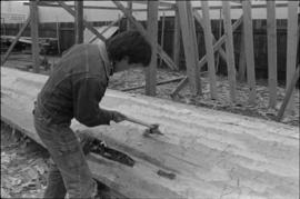 Crew working on log at the Turnbull & Gail construction yard in Richmond (contractors for bui...