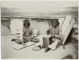 Zuni men making shell necklaces
