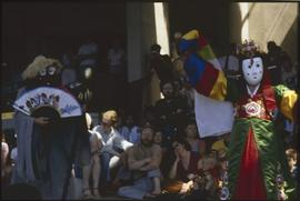 Masked dancers with audience