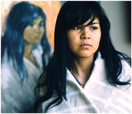 Klaskhana (Haida) portrait with painting in background by Minn Sjolseth