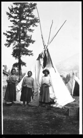 Portrait of three women and tipi