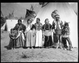 Group portrait of a man, several women and children