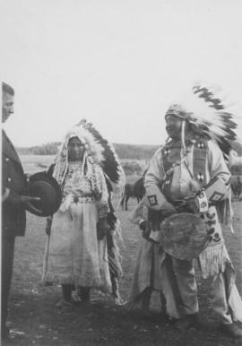 Chief Jacob Chiniki with his wife making a presentation to the Governor General