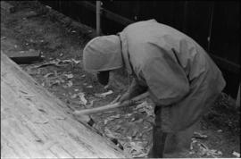 Crew working on log at the Turnbull & Gail construction yard in Richmond (contractors for bui...