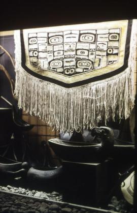 Chilkat blanket, feast dishes, and spoons on display in Montréal