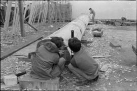 Crew working on log at the Turnbull & Gail construction yard in Richmond (contractors for bui...