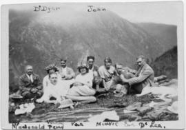 Nine people reclining outdoors