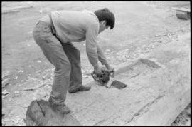 Crew working on log at the Turnbull & Gail construction yard in Richmond (contractors for bui...