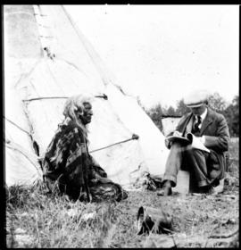 Portrait of two men in front of tipi, view two