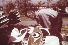 Mungo Martin working on a totem pole