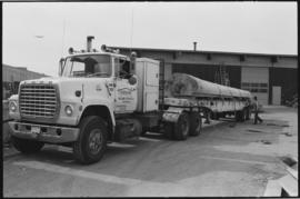 Crew moving log from the Turnbull & Gail construction yard in Richmond (contractors for build...