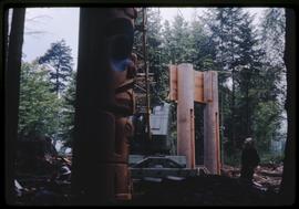 Bill Reid watching the construction of the Haida house