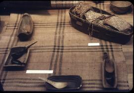 Spoons, dishes, and other items on display